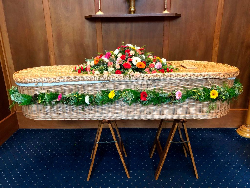 Brightly Coloured Coffin Arrangement using Gerbera and Carnations